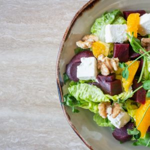 bowl of vegetable salad with walnuts